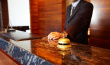 ist1_10761811-male-concierge-at-a-reception-desk